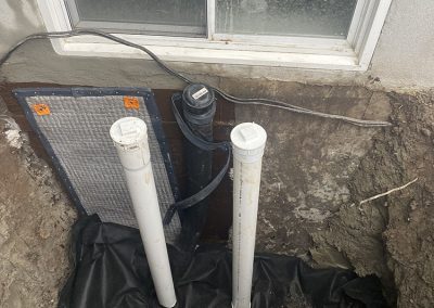Réparation de fissures avec installations de colonne accès au drain