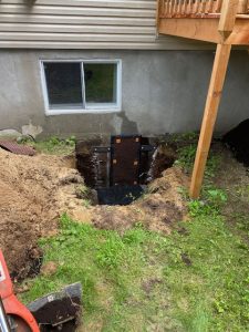 Réparation de fondation avec correcte de pente négative dans la région de Mascouche - Alain Fissure