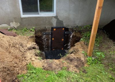 Réparation de fondation avec correcte de pente négative dans la région de Mascouche - Alain Fissure